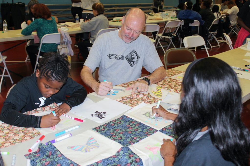 BC President J. David Armstrong, Jr. colors a picture for MLK Day