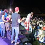 Wyclef Jean and students on stage