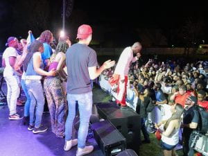 Wyclef Jean and students on stage